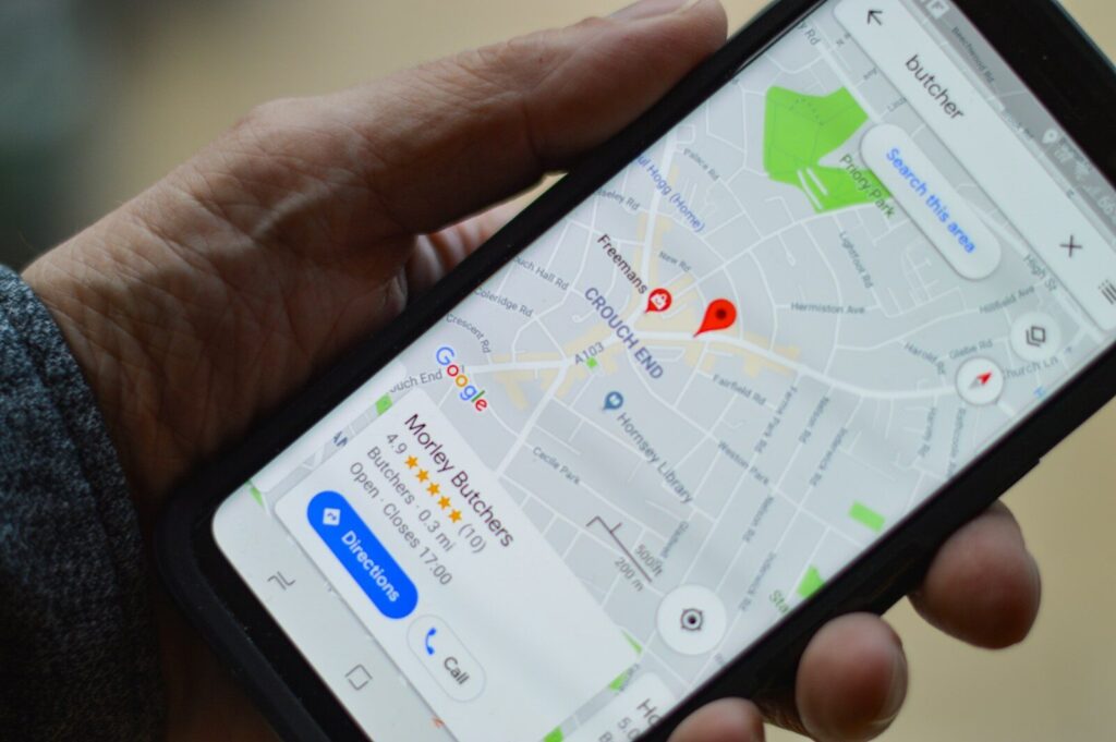 Person viewing a local business listing on Google Maps on their phone